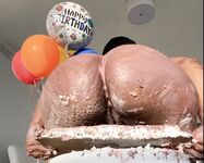 Olivia sits on my birthday cake