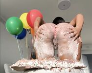 Olivia sits on my birthday cake