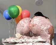 Olivia sits on my birthday cake