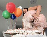 Olivia sits on my birthday cake