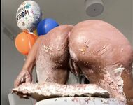 Olivia sits on my birthday cake